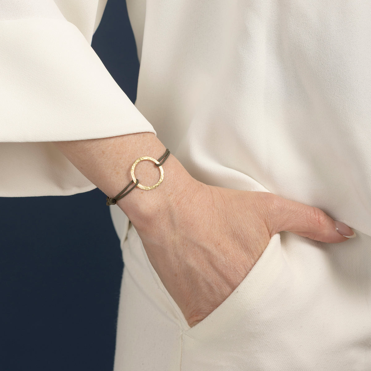Gold and cord bracelet